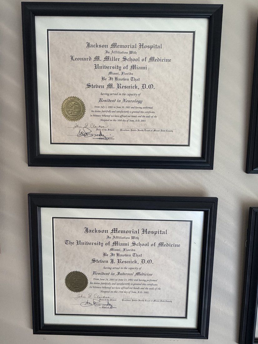 Internal Medicine and Neurology residency diplomas.